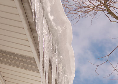 Ice-damming gutters
